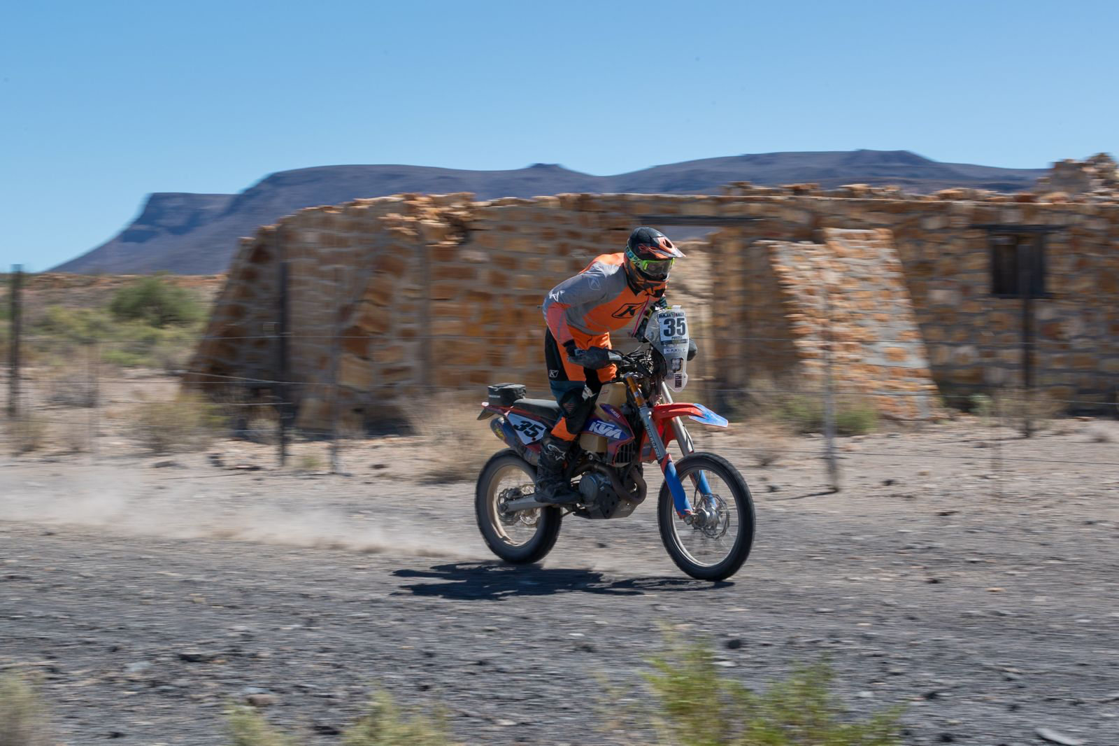 Scott Purcell racing through the Baja desert on his motorcycle