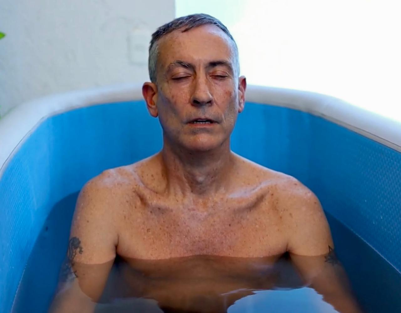 Scott Purcell in a cold plunge — eyes closed, meditative, practicing purposeful stress